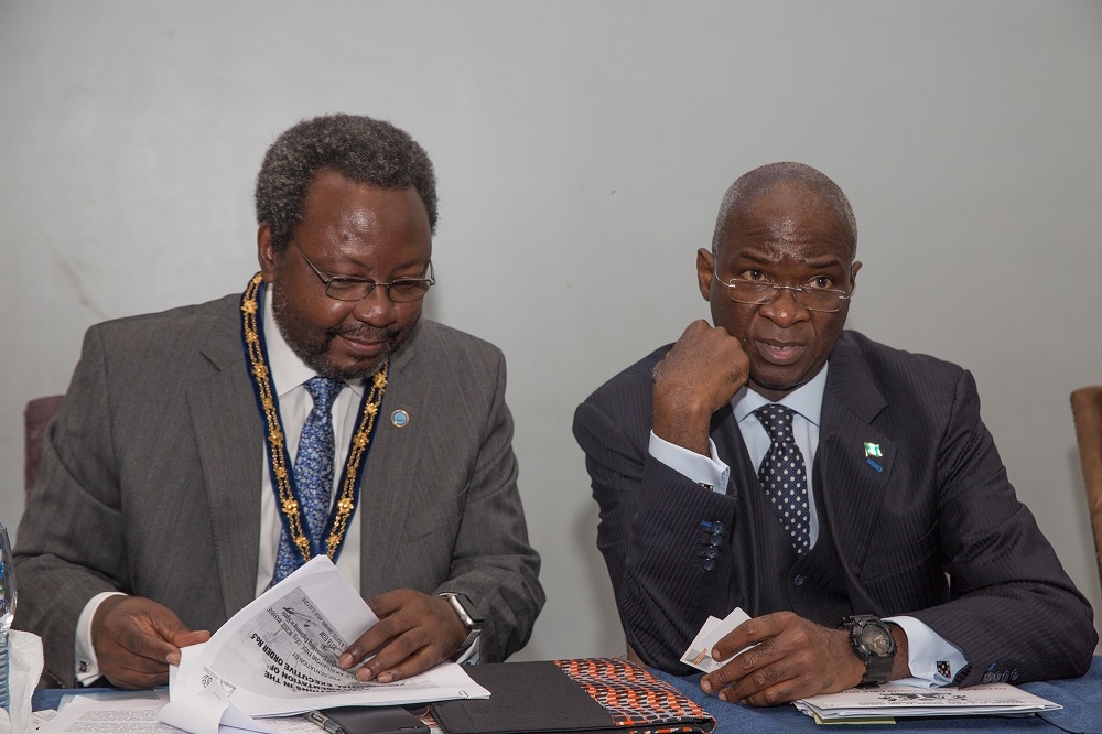 Hon Minister of Power Works  Housing and Guest Speaker Mr Babatunde FasholaSANleftand President Association for Consulting Engineering in Nigeria Engr Charles Yele Akindayomi right during the 2018 Extra Ordinary General Meeting with the theme The Role of Engineering Consultants in the Implementation of the Presidential Executive Order 5 organized by theAssociation for Consulting Engineering in Nigeriaat the NAF Conference Centre  SuitesAbuja on Thursday 5th July 2018