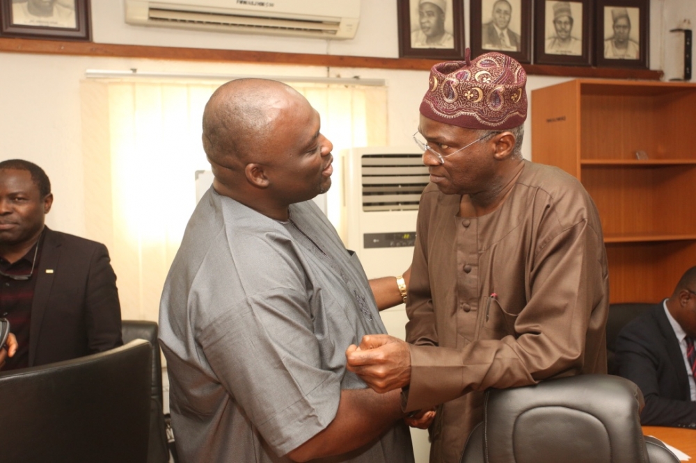 Hon Minister of Power Works  Housing Mr Babatunde FasholaSANright and Chairman Electrical  Electronics Sectoral Group Mr George Onafowokanleft during the courtesy visit to the Hon Ministers at the Ministry of PowerWorks  Housing Headquarters Mabushion Monday 6th August 2018