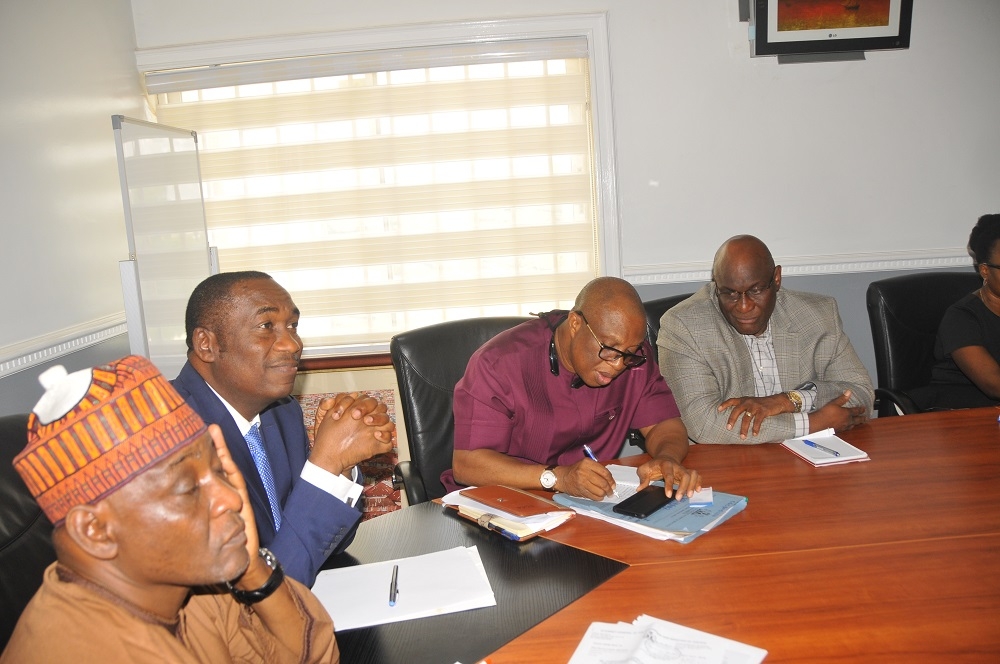 Honourable Minister Mr Babatunde Fashola SAN receives Dr Kayode Fayemi Ekiti State Governor elect at the Ministrys Headquarter Mabushi Abuja 