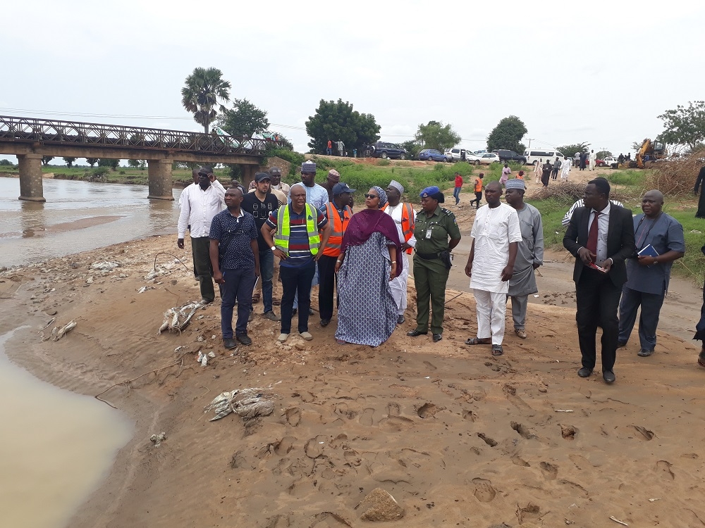 Inspection of damage Kudzum Bridge at Section CH 26  500 Yola  Mubi Road Adamawa State by Senator Binta Masi Garba Engr Yemi Oguntominiyi Director Highway Construction and Rehabilitation Dr Famous Eseduwo Director Planning Research and Statistics Engr MR Muhammad Director HNE Engr Salihu A O Federal Controller Adamawa State and other staff of the Federal Ministry of Power Works and Housing on the 26th of August 2018