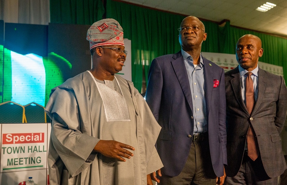 Hon Minister of Power Works  Housing Mr Babatunde Fashola SAN left Minister of Transportation Dr Rotimi Amaechiright and Governor of Oyo State Sen Abiola Ajimobi middle in agroup photograph shortly after the Special Town Hall Meeting on Infrastructureat the Emeritus Professor Theophilus Ogunlesi Hall opposite UCH main gateQueen Elizabeth road Ibadan Oyo State on Thursday 25th October 2018