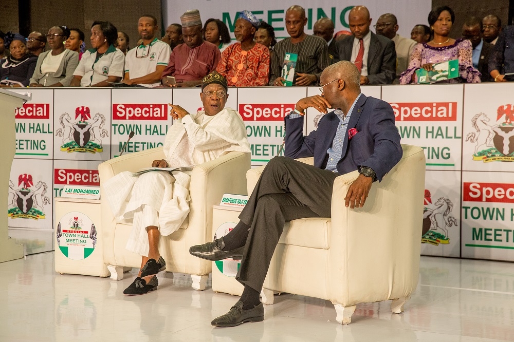 Hon Minister of Power Works  Housing Mr Babatunde Fashola SANleft and Minister of Information  Culture Alhaji Lai Mohammedright duringthe Special Town Hall Meeting on Infrastructureat the Emeritus Professor Theophilus Ogunlesi Hall opposite UCH main gateQueen Elizabeth road Ibadan Oyo State on Thursday 25th October 2018