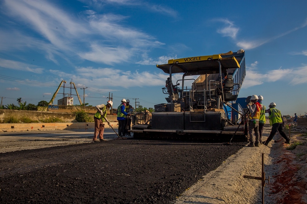 Personnel of JuliusBerger laying the asphalt at the Ibafo area during an inspectionof the ongoing Rehabilitation Reconstruction and Expansion of theLagos Ibadan Expresswayby the HonMinister of Power Works  Housing Mr Babatunde Fashola SANon Thursday 25th October 2018