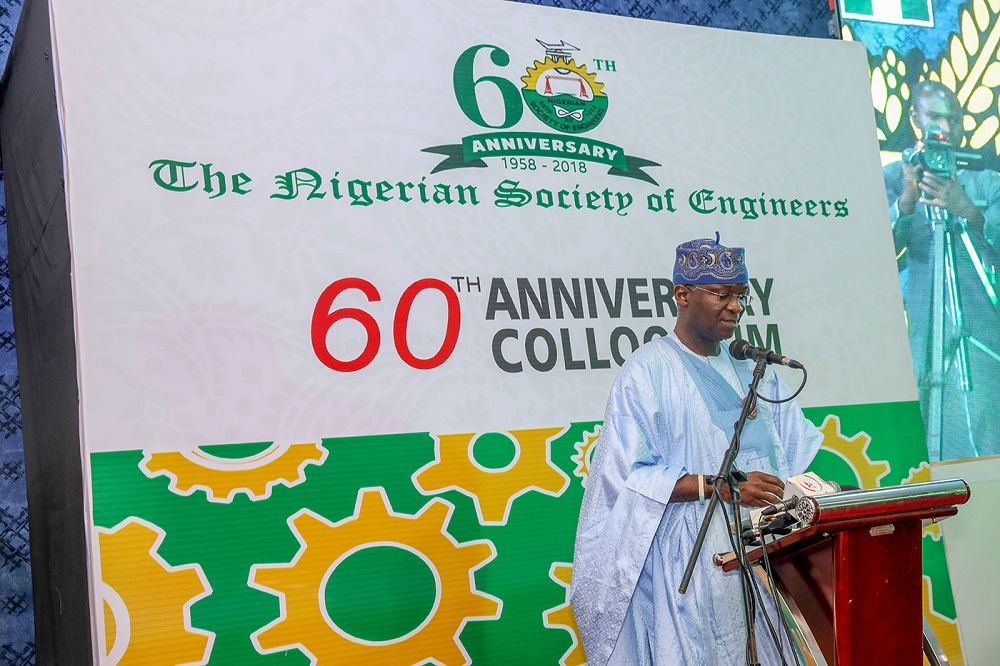 Representative of the President   Hon  Minister of Power  Works   Housing  Mr Babatunde Fashola SAN right  delivering the Goodwill message of President Muhammadu Buhari during the Nigerian Society of Engineers  60th Anniversary Colloquium with the theme    Re Engineering the Engineers for Optimum National Economic Growth and Development       at the Conference Hall  NAF Conference Centre   Suites on Friday 23rd November 2018