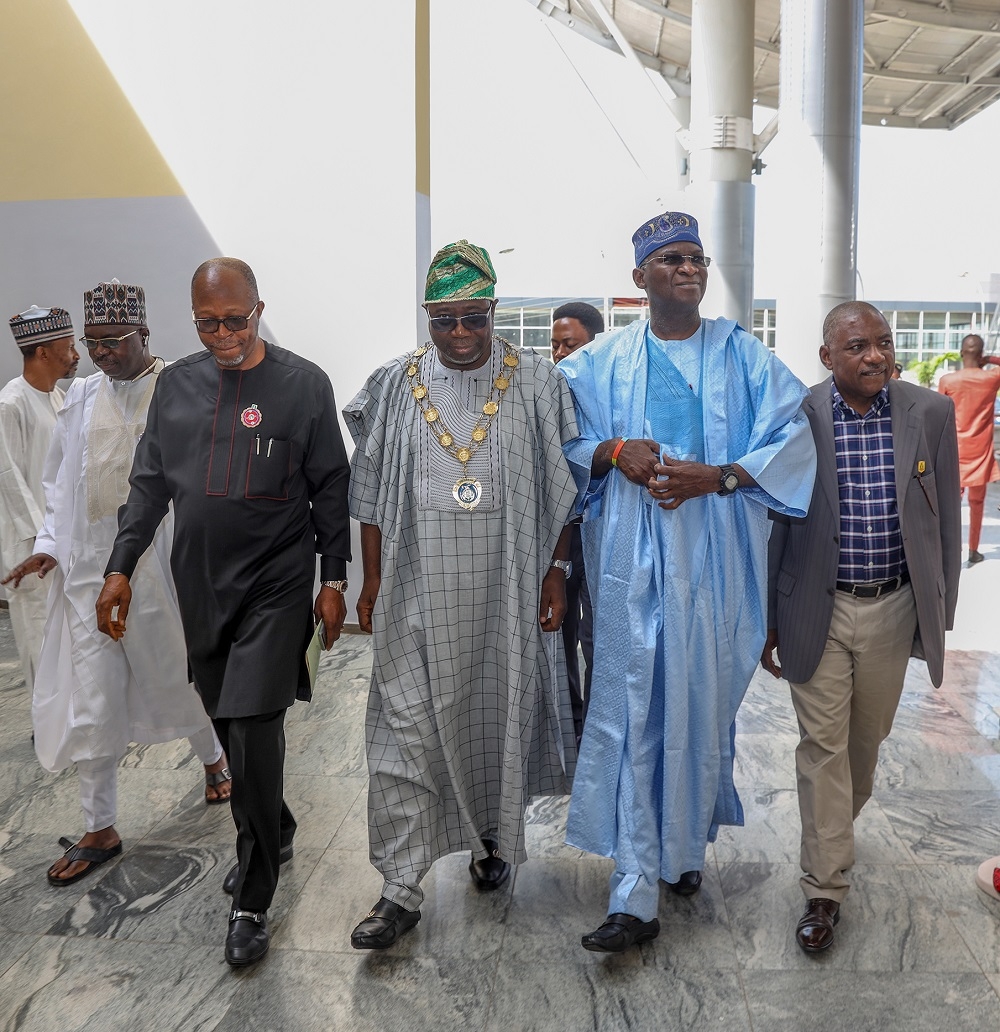 Representative of the President   Hon  Minister of Power  Works   Housing  Mr Babatunde Fashola SAN 2nd right   President of the Nigerian Society of Engineers  Engr  Adekunle Mokuolu middle  and others  during the Nigerian Society of Engineers  60th Anniversary Colloquium with the theme    Re Engineering the Engineers for Optimum National Economic Growth and Development       at the Conference Hall  NAF Conference Centre   Suites on Friday  23rd November 2018