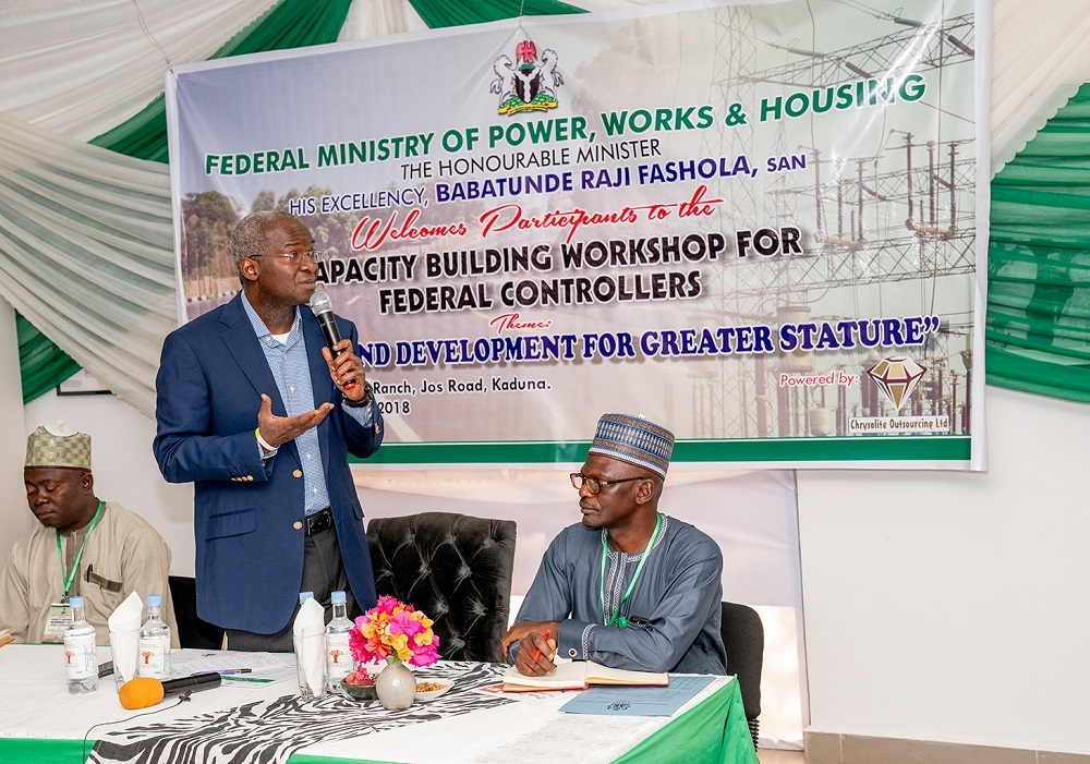 Hon  Minister of Power  Works   Housing  Mr Babatunde Fashola  SAN middle   Director Highways  North East Zone  Engr  Rufai Mohammed  left  and Acting Director  Human Resources  Mr Ahmed Iya  right  during   the Opening Ceremony of the Capacity Building Workshop for Federal Controllers of Works in the Ministry of Power  Works   Housing with the theme    Learning and Deveploment for Greater Stature    at the Fifth Chukker Polo Ranch  Jos Road  Kaduna State on Monday 26th  November 2018