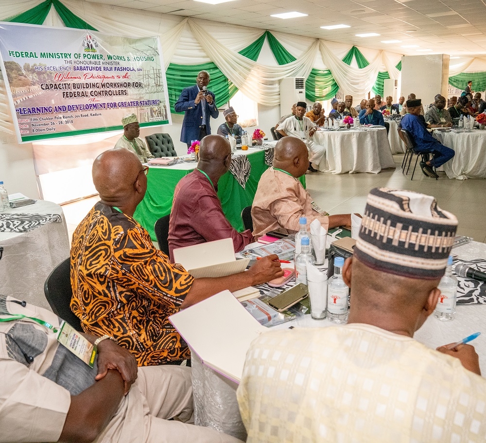 Hon  Minister of Power  Works   Housing  Mr Babatunde Fashola  SAN  left  addressing the participants during  the Opening Ceremony of the Capacity Building Workshop for Federal Controllers of Works in the Ministry of Power  Works   Housing with the theme    Learning and Deveploment for Greater Stature    at the Fifth Chukker Polo Ranch  Jos Road  Kaduna State on Monday 26th  November 2018