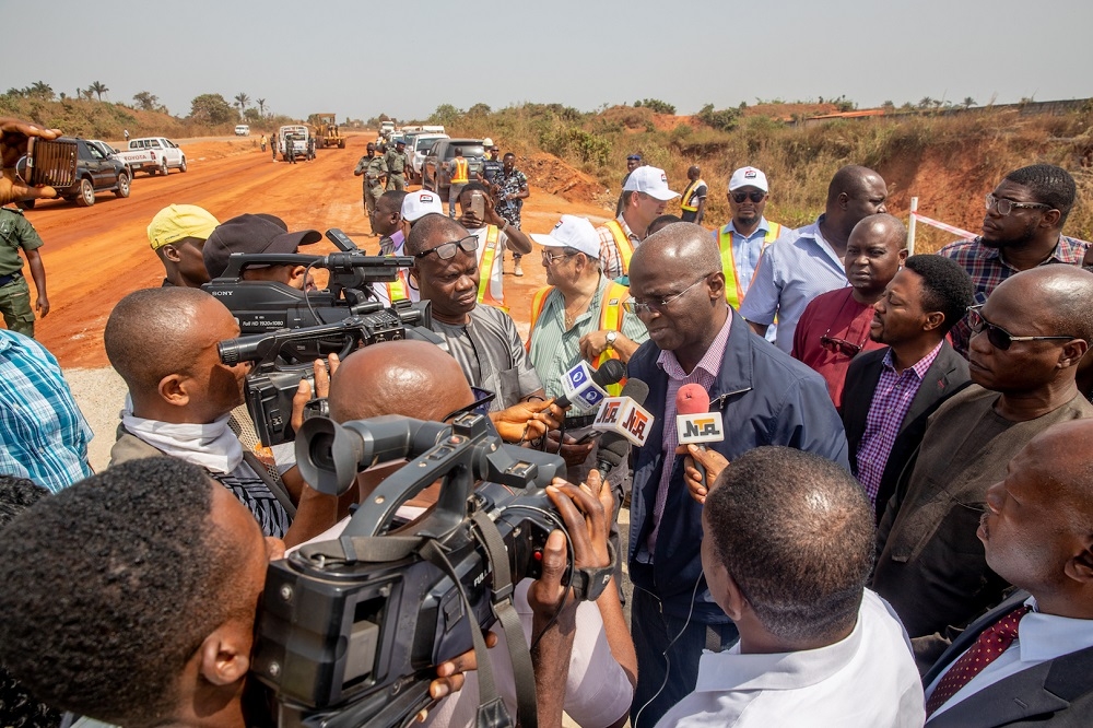 Work in Progress   Hon  Minister of Power  Works   Housing  Mr Babatunde Fashola  SAN right  speaking to media men shortly after    inspecting   the ongoing Rehabilitation of Outstanding Sections of Onitsha  Enugu Expressway  Enugu     Amansea  Enugu State border  in Enugu State and Umunya     Amawbia Section in Anambra State on Monday 10th  December 2018