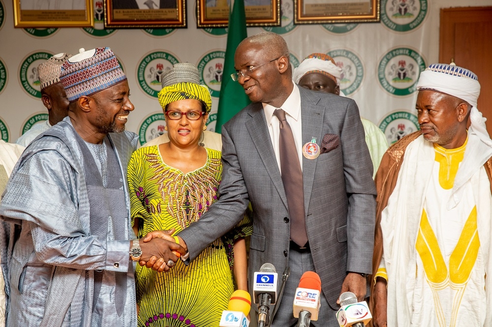 Hon  Minister of Power  Works   Housing  Mr Babatunde Fashola  SAN 2nd right   Village Head of Gora  Alhaji  Jafaru Adamu right   Elder in Community  Prof  Moh   d Sani Haruna left  and  Farming Entrepreneur  Hajia Kareen Fatimah Mohammad   2nd left    shortly after a Courtesy Thank You Visit for the completion and deployment of 24 7 Solar Power in the Anguwan  Neighborhood Villages  of Gora Community in Karu Local Government Area of Nasarawa State by the Rural Electrification Agency  REA  as part of the Federal Government s  Rural Electrification Strategic Implementation Plan  at the Ministry of Power  Works   Housing Headquarters  Mabushi  Abuja on Tuesday  11th   December 2018