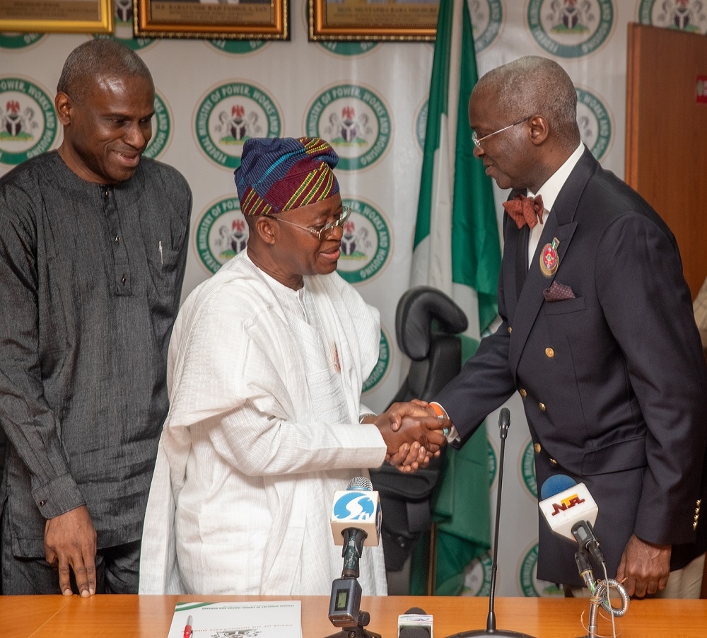 Hon  Minister of Power  Works   Housing  Mr Babatunde Fashola  SAN right    Permanent Secretary  Power  Engr  Louis Edozien  left  and Governor  State of Osun   Mr Isiaka Gboyega Oyetola middle    in a group photograph shortly after a  meeting on State of Osun s infrastructural development   at   the Ministry of Power  Works and Housing Headquarters  Mabushi  Abuja on Monday 17th  December 2018