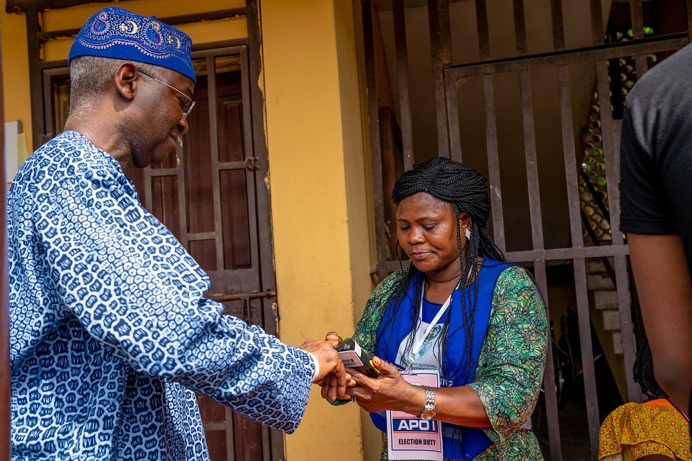 Hon  Minister of Power  Works   Housing  Mr Babatunde Fashola  SAN  left  being accredited during the Governorship and House of Assembly Polls at the Ward G3  Unit E002  State Junior Grammar School  Itolo Street  Surulere  Lagos on Saturday 9th  March 2019