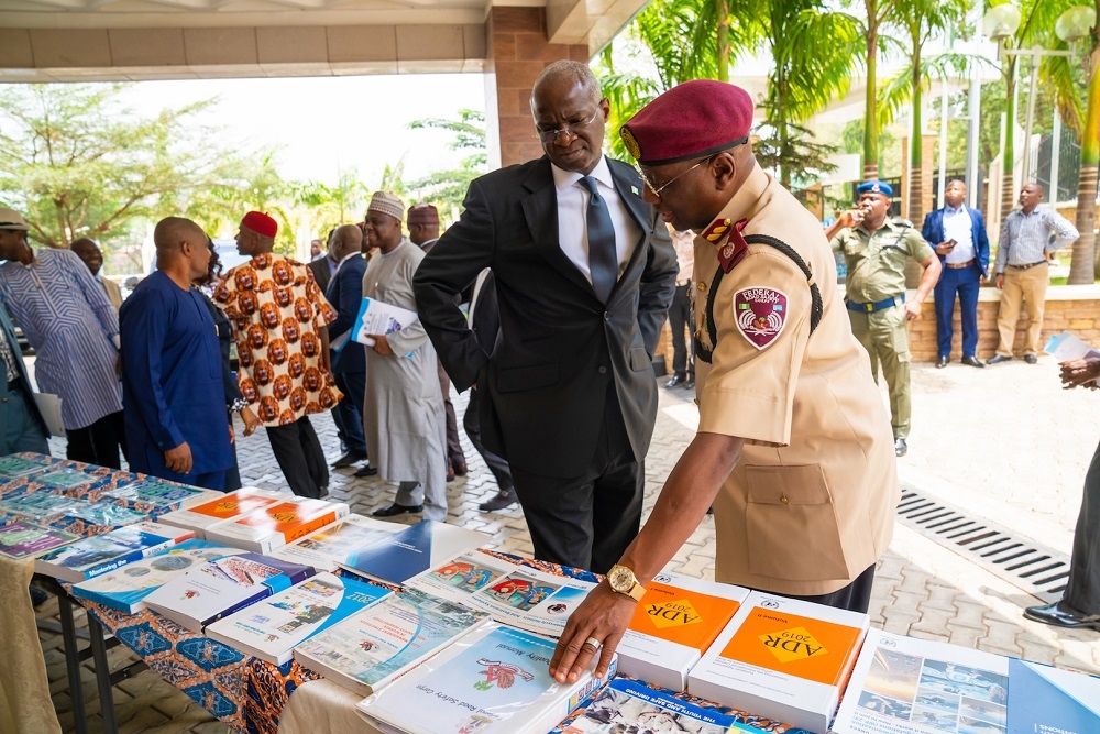 Hon  Minister of Power  Works   Housing  Mr Babatunde Fashola  SAN left  and Corps Marshal of the Federal Road Safety Commission  FRSC  Dr Boboye Oyeyemi  right   at the Exhibition Stand shortly after the Opening Session of the  Workshop on the Activation of the Five  5  United Nations Conventions on Road Traffic Acceded to by Nigeria at the Central Bank of Nigeria International  Training  Institute  02 Lasele Street  Off Shehu Shagari Way  Maitama  Abuja on Tuesday 21st March 2019