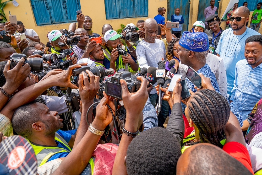 Hon  Minister of Power  Works   Housing  Mr Babatunde Fashola  SAN  right  speaking with journalists shortly after casting his vote during the Governorship and House of Assembly Polls at the Ward G3  Unit E002  State Junior Grammar School  Itolo Street  Surulere  Lagos on Saturday 9th  March 2019