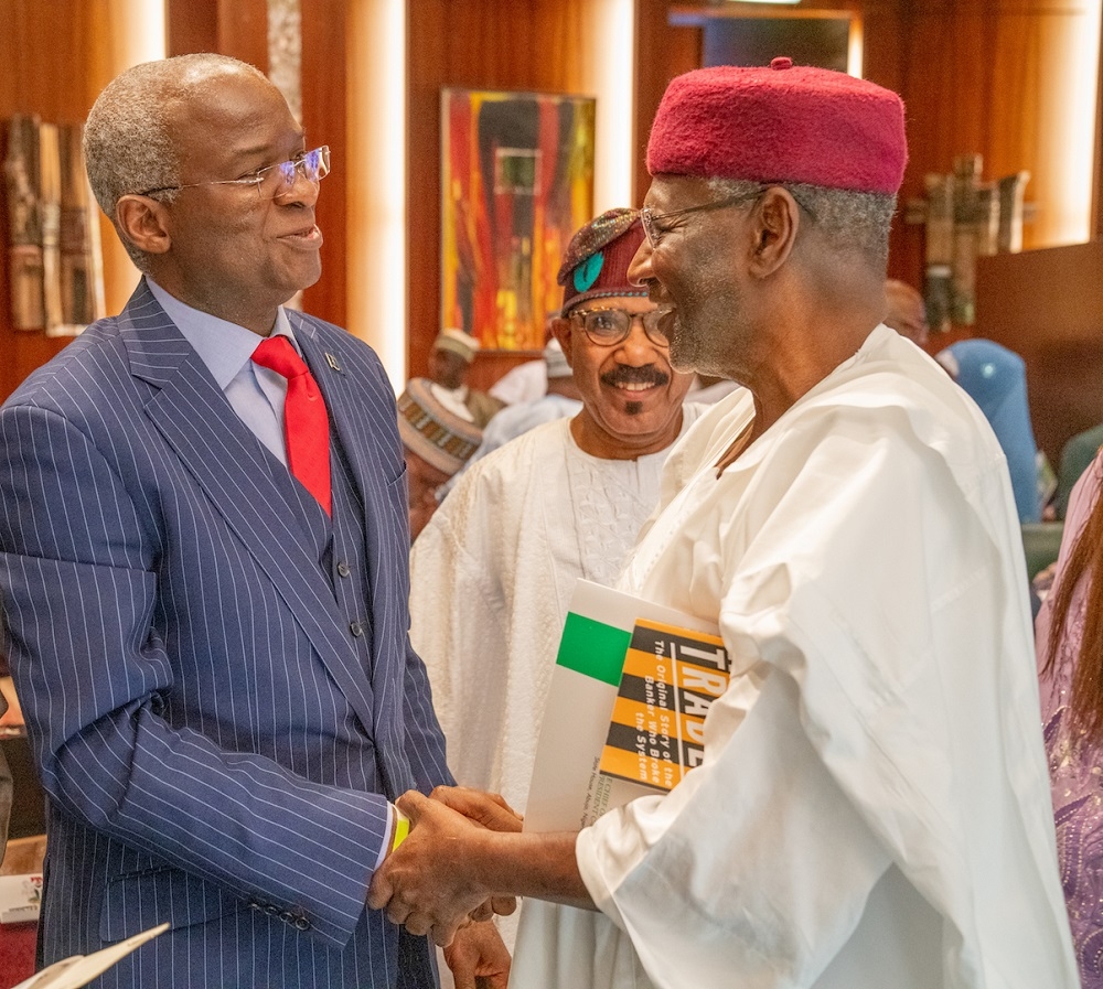 Chief of Staff to the President  Mr Abba Kyari  right  congratulating   Mr  Babatunde Raji   Fashola SAN right  after the latter took the oath of office as the   Minister of   Works   Housing  at the Presidential Villa in Abuja on Wednesday  21st August 2019