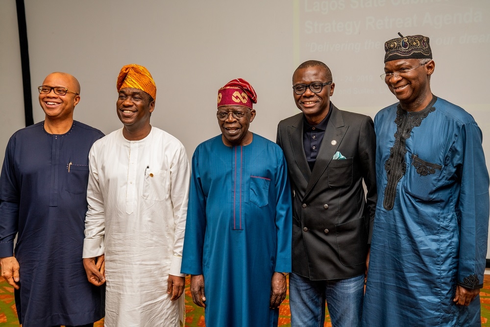 Hon  Minister of Works   Housing  Mr  Babatunde   Fashola SAN  right  National Leader of the All Progressives Congress   Asiwaju Bola Ahmed Tinubu  middle    Governor of Lagos State  Mr Babajide Sanwo Olu  2nd right   his Deputy  Dr Obafemi Hamzat  2nd left  and Director General Budget Office of the Federation in a group photograph shortly  before the Minister facilitated a Session on    Personal Perspectives on Leadership   at the 2019 Lagos State Executive Council and Body of Permanent Secretaries Retreat with the theme   Delivering the Lagos of our Dreams  at the Eko Hotel and Suites  Victoria Island  Lagos on Friday  23rd August 2019