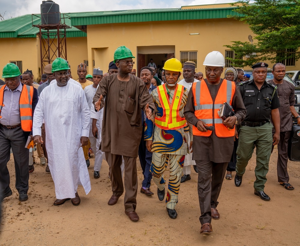 Hon  Minister of Works   Housing  Mr Babatunde Fashola SAN 2nd left   Minister of State in the Ministry  Engr  Abubakar Aliyu  left    the Director Engineering Services  Engr  Julius Olurinola  right    Director  Central Workshops   Equipment  Engr Felix Ebuzoeme  2nd right   and others  during the inspection of the Federal Ministry of Works   Housing s Engineering Centre comprising the Zonal Workshop   Electrical  Mechanical Training School in Kuje  Abuja on Friday  13th September 2019