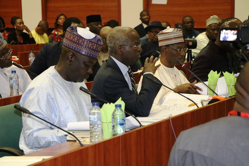 Hon  Minister of Works   Housing  Mr Babatunde Fashola SAN 2nd left   Minister of State in the Ministry  Engr  Abubakar Aliyu  3rd left   Permanent Secretary  Works   Housing  Mr  Mohammed Bukar middle  and others  during the First Interactive Session with the Senate Committee on Works at the Conference Room 231  New Senate Building   National Assembly Complex  Abuja on Thursday  3rd October 2019