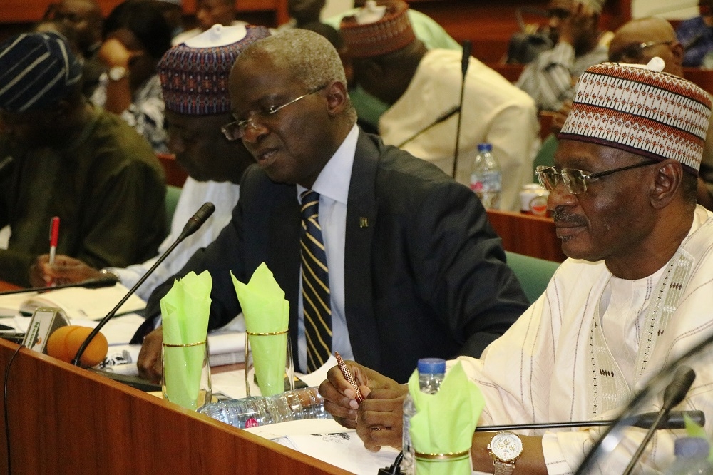 Hon  Minister of Works   Housing  Mr Babatunde Fashola SAN 2nd left   Minister of State in the Ministry  Engr  Abubakar Aliyu  3rd left   Permanent Secretary  Works   Housing  Mr  Mohammed Bukar middle  and others  during the First Interactive Session with the Senate Committee on Works at the Conference Room 231  New Senate Building   National Assembly Complex  Abuja on Thursday  3rd October 2019