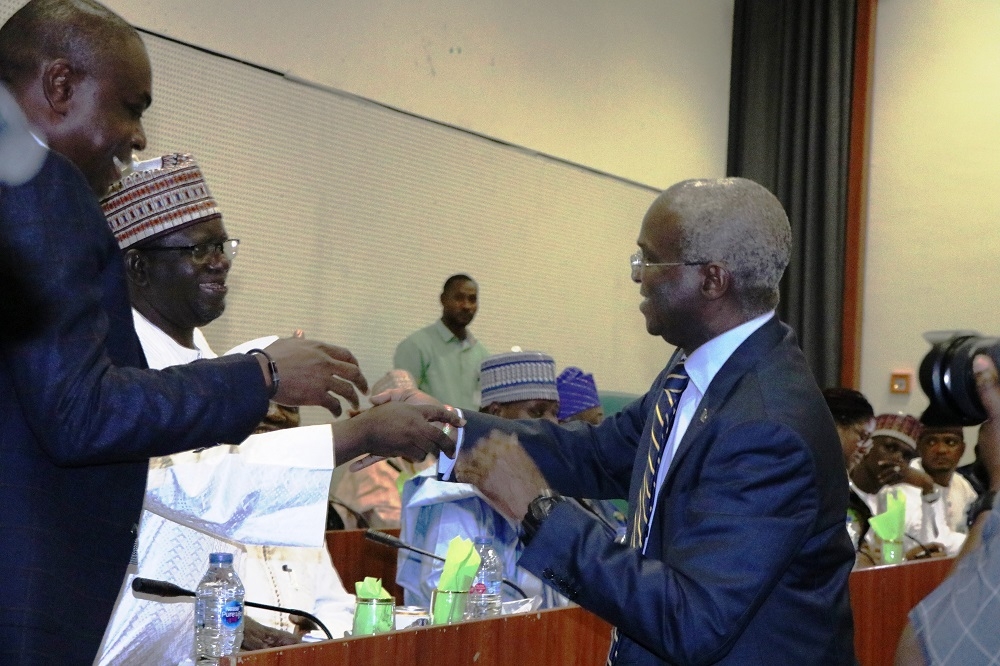 Hon  Minister of Works   Housing  Mr Babatunde Fashola SAN 2nd left   Minister of State in the Ministry  Engr  Abubakar Aliyu  3rd left   Permanent Secretary  Works   Housing  Mr  Mohammed Bukar middle  and others  during the First Interactive Session with the Senate Committee on Works at the Conference Room 231  New Senate Building   National Assembly Complex  Abuja on Thursday  3rd October 2019