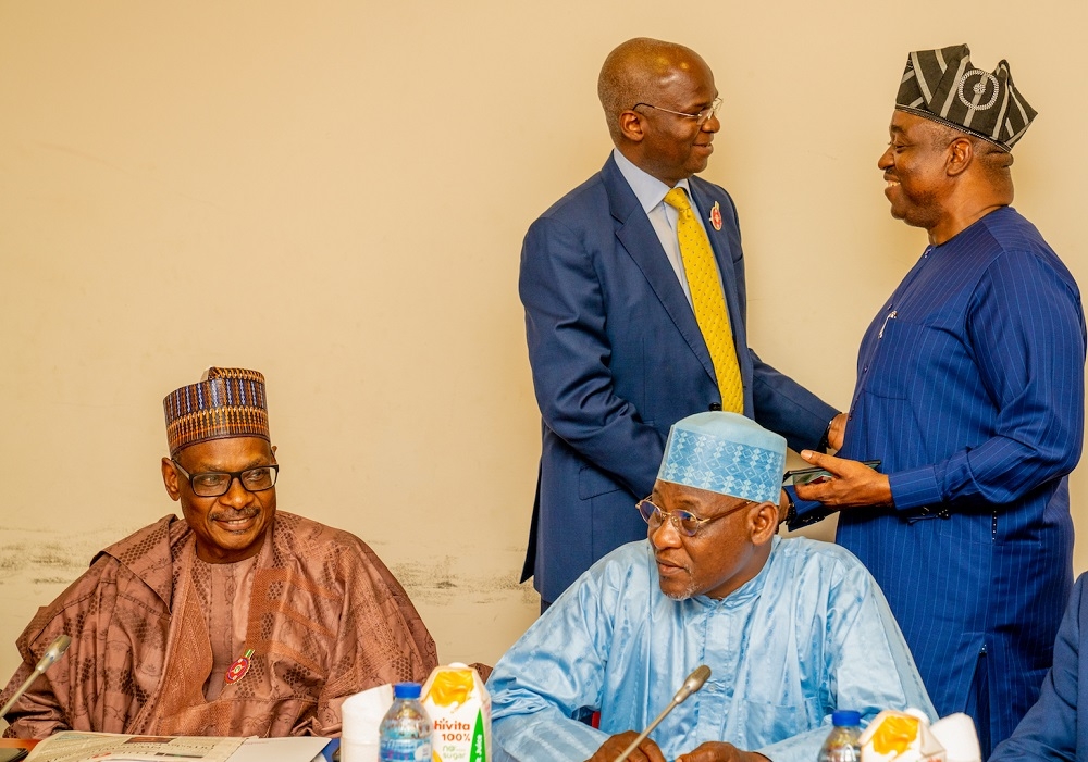 Hon  Minister of Works   Housing  Mr Babatunde Fashola SAN 2nd right  and    Committee member Senator representing Benue North East  Senator Gabriel Suswam  right  standing    Permanent Secretary  Works   Housing  Mr  Mohammed Bukar left  and Director Procurement in the Ministry  Mr Ibrahim Musa Badeiri  right  sitting   shortly before the meeting with the Senate Committee on Sustainable Development Goals at the Committee Room 324 Senate Wing  National Assembly Complex  Abuja on Monday  4th November 2019