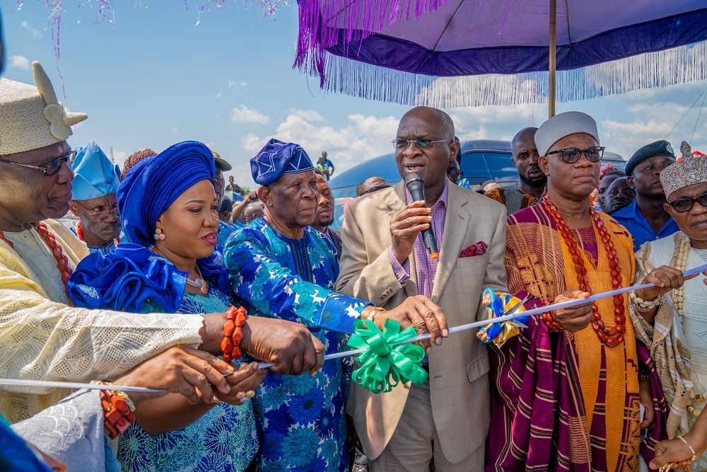 Hon  Minister of Works   Housing  Mr Babatunde Fashola SAN 3rd right    Chairman  Elizade Group and Aare Atayese of llara   Mokin  Chief Micheal Ade  Ojo   3rd left  his wife  Mrs Taiwo Ade Ojo  2nd left    Alara of llara   Mokin  Ondo State  Oba Abiodun Aderemi Adefehinti left   and others during the Grand Opening Ceremony and Official Commissioning of the 6KM Road Network in Ilara  Mokin  Akure  Ondo State constructed by Chief Ade Ojo on Saturday  9th November 2019