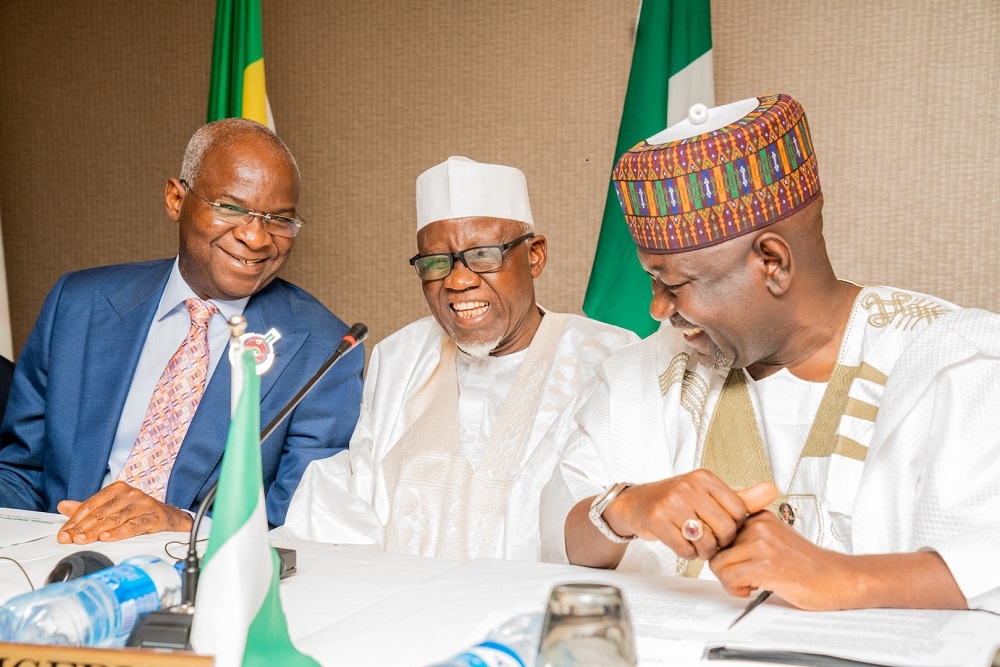 Representative of His Excellency  President Muhammadu Buhari  Hon  Minister of Police Affairs  Alh  Mohammed Dingyadi middle  Hon  Minister of Works   Housing  Mr Babatunde Fashola SAN left   and Minister of State in the Ministry  Engr  Abubakar Aliyu  right   during the Opening Ceremony of the 70th Session of the Trans Saharan Road Liaison  Committee  TRLC  hosted by the Federal Ministry of Works   Housing at the Transcorp Hilton Hotel Abuja on Monday  11th November 2019 