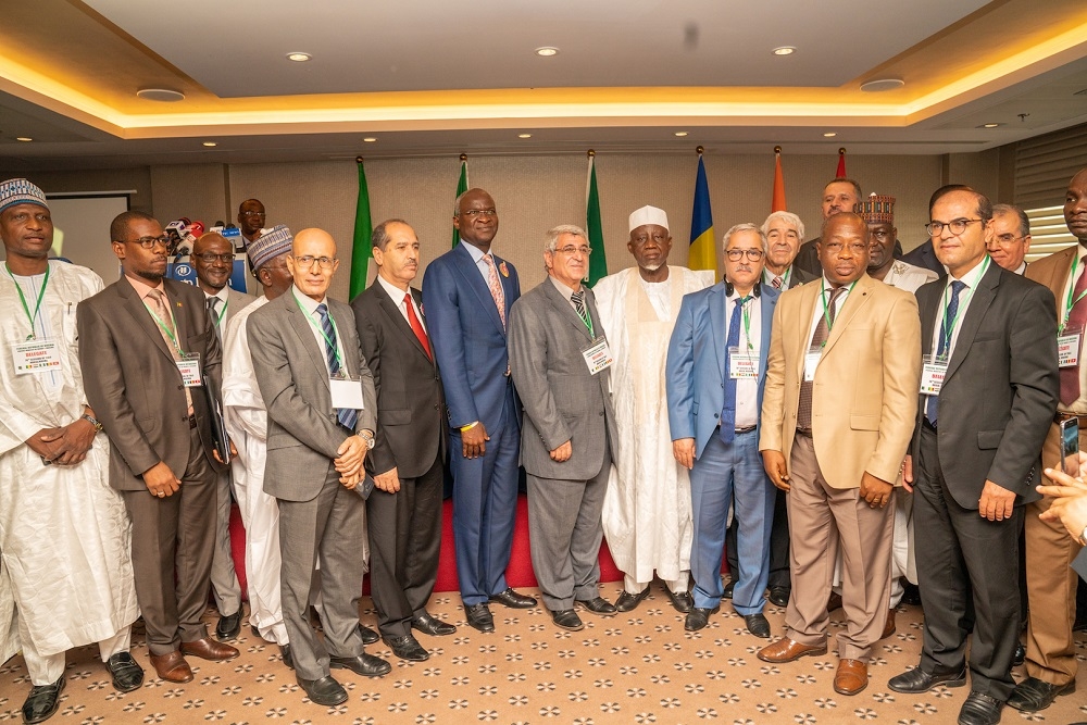 Representative of His Excellency  President Muhammadu Buhari  Hon  Minister of Police Affairs  Alh  Mohammed Dingyadi 5th right  Hon  Minister of Works   Housing  Mr Babatunde Fashola SAN 6th left   Minister of State in the Ministry  Engr  Abubakar Aliyu  3rd right  other Ministers  Technical Experts and Delegates from Member Countries  in a group photograph shortly after  the Opening Ceremony of the 70th Session of the Trans Saharan Road Liaison  Committee  TRLC  hosted by the Federal Ministry of Works   Housing at the Transcorp Hilton Hotel Abuja on Monday  11th November 2019 