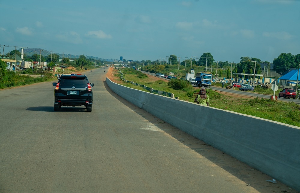 View of the ongoing Reconstruction and Expansion of the   Abuja Kaduna Zaria Kano Road   Section I  Abuja  Kaduna during an inspection tour by  Hon  Minister of Works   Housing  Mr Babatunde Fashola SAN  the  Minister of State in the Ministry  Engr  Abubakar Aliyu  and other    Ministers from   Member Countries of the Trans Sahara Road Liaison Committee  on Tuesday  12th November 2019