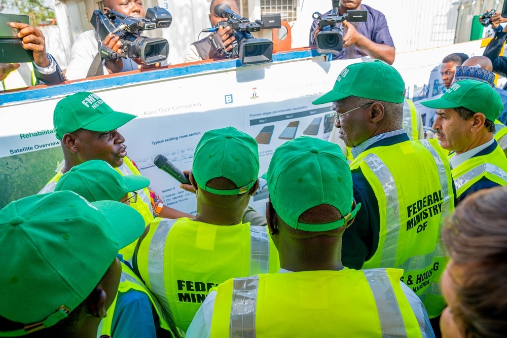 Hon  Minister of Works   Housing  Mr Babatunde Fashola SAN 2nd right  Minister of State in the Ministry  Engr  Abubakar Aliyu 2nd left  and  other    Ministers from   Member Countries of the Trans Sahara Road Liaison Committee being briefed  during an inspection tour of the ongoing Reconstruction and Expansion of the   Abuja Kaduna Zaria Kano Road   Section I  Abuja  Kaduna  on Tuesday  12th November 2019