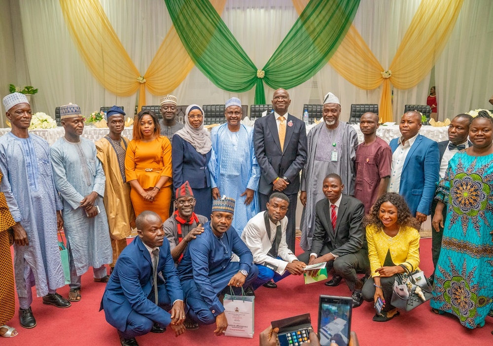 Hon  Minister of Works   Housing  Mr Babatunde Fashola SAN 6th right    Federal Civil Service Commission and Commissioner for Osun   Oyo States  Engr  Fatai Adebayo Olapade   5th right    Executive Director   Loans   Mortgage Services  Federal Mortgage Bank of Nigeria  Mrs Rahimatu Aminu Aliyu   5th left  and  Ag  Permanent Secretary   Ministry of Power  Engr  Ahmed Abu 6th left  and others  in a group photograph with Award Winning members of Staff shortly after   the Federal Ministry of Works   Housing 2018 Recognition   Reward Ceremony at the Idris  A Abdulkadir Auditorium National Universities Commission Maltama  Abuja