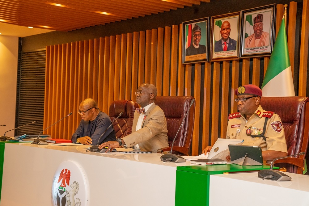 Hon  Minister of Works   Housing  Mr Babatunde Fashola SAN  middle  Corps Marshal of the Federal Road Safety Corps  Dr Boboye Oyeyemi  right  and Director Highways  Construction and Rehabilitation  Engr Oluyemi Oguntominiyi  left   during a meeting with Federal Controllers of Works in the 36 States  representatives of the Federal Road Maintenance Agency  FERMA  and Federal Government Contractors on the Ember Months Operations for Better Travel Experience at the Federal Ministry of Works   Housing Headquarters  Mabushi  Abuja on Thursday  21st November 2019