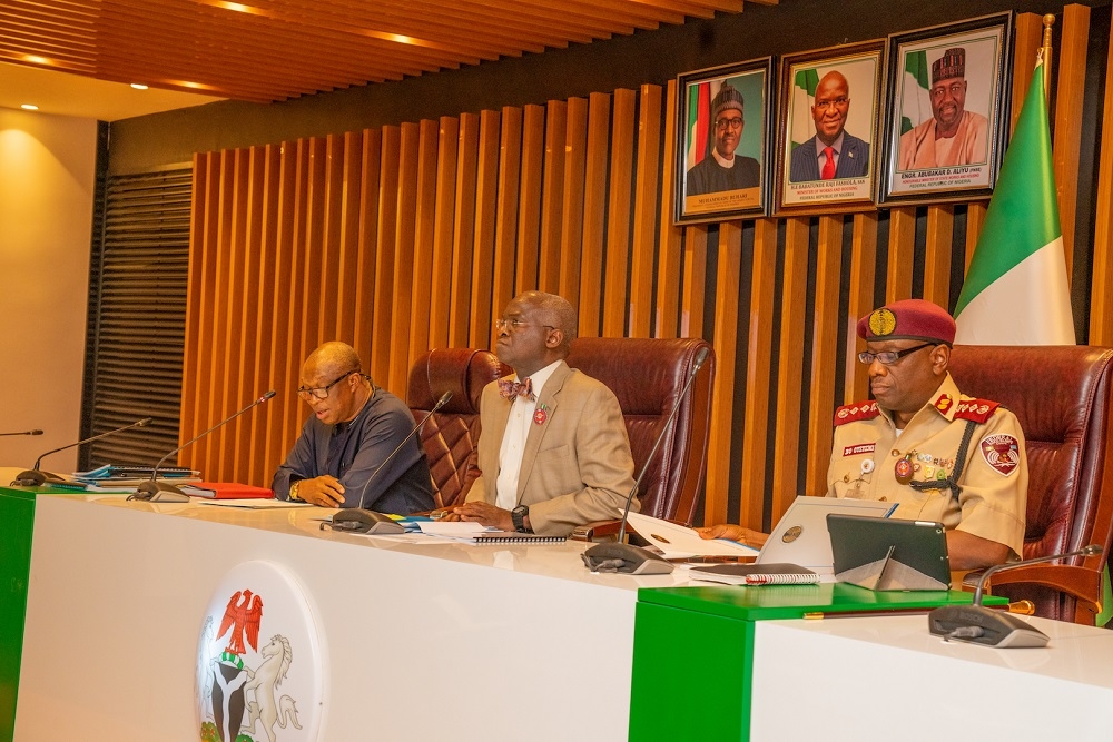 Hon  Minister of Works   Housing  Mr Babatunde Fashola SAN middle   representative of Chairman  Federal Civil Service Commission and Commissioner for Osun   Oyo States  Engr  Fatai Adebayo Olapade right    Executive Director   Loans   Mortgage Services  Federal Mortgage Bank of Nigeria  Mrs Rahimatu Aminu Aliyu left   Ag  Permanent Secretary  Ministry of Power  Engr  Ahmed Abu 2nd left  and Most Outstanding Director of the Year and Director   Highways Planning and Development  Engr  Chukwunwike Ogbonna Uzo 2nd right   in a group photograph shortly after   the Federal Ministry of Works   Housing 2018 Recognition   Reward Ceremony at the Idris  A Abdulkadir Auditorium National Universities Commission Maitama  Abuja