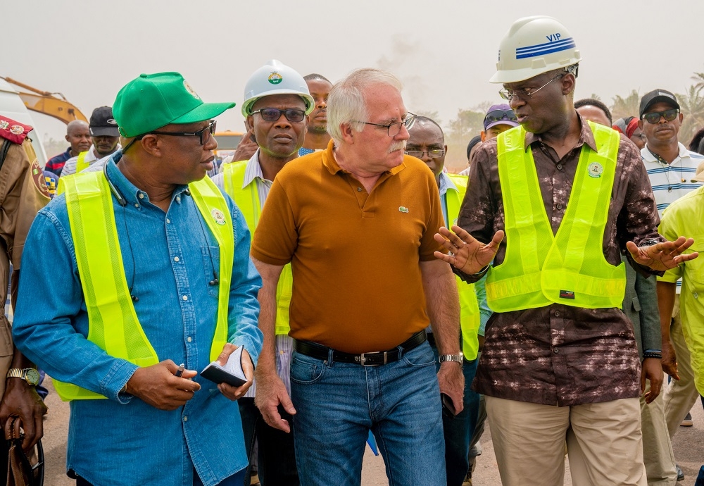 Hon  Minister of Works   Housing  Mr Babatunde Fashola SAN right   Director  Highways  Construction and Rehabilitation  Engr  Yemi Oguntominiyi left  and   Project Manager  Dantata   Sawoe Nigeria Limited  Engr  Policarpo Lewis during the Hon  Minister s inspection of ongoing   Dualization of Lokoja     Benin Road  Obajana Junction     Benin  Section Ill  Phase l  Auchi   Ehor  Edo State  as part of the tour of Federal Government  Highway and Housing Projects  in the South South on Monday  10th February 2020