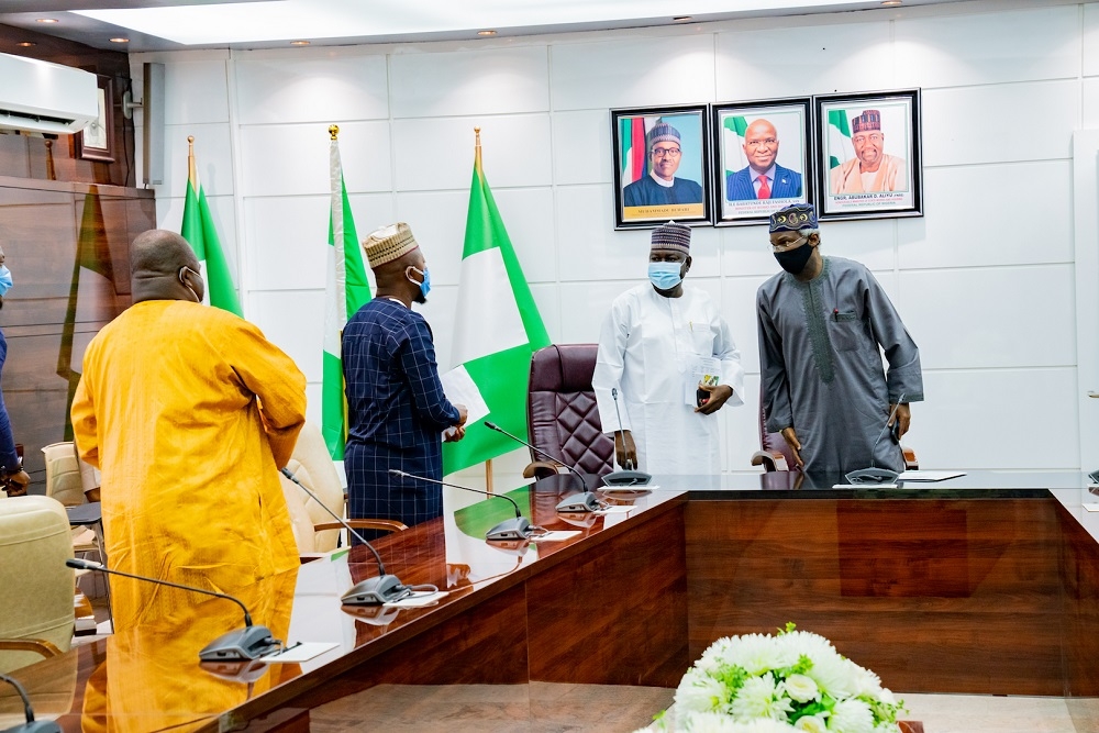 Hon  Minister of Works and Housing  Mr Babatunde Fashola SAN right   Minister of State in the Ministry  Engr  Abubakar Aliyu 2nd right   President  Trade Union Congress of Nigeria  TUC    Mr Quadri Olaleye left  and Secretary General  Trade Union Congress of Nigeria  Mr Musa Lawal 2nd left  during a courtesy visit by the Trade Union Congress of Nigeria to the Minister at the Ministry of Works and Housing Headquarters  Mabushi  Abuja on Friday  10th July 2020