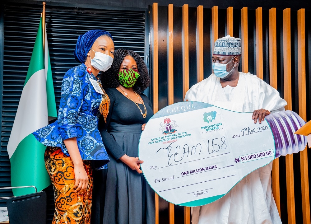 Hon.Â Minister of State in the Ministry of Works and Housing, Engr. Abubakar Aliyu(right)Â presenting an Award to the 3rdÂ runner-up Team Leaders, Miss Zainab Saka(middle) and Miss Tolu Ibitoye(left) duringÂ the Award CeremonyÂ of the Maiden Edition of the Federal Civil Service Innovation Competition 2020-Â organized by the Office of the Head of the Civil Service of the Federation at the Ministry of Works and Housing Conference Hall, Mabushi, Abuja on Friday,7th August 2020