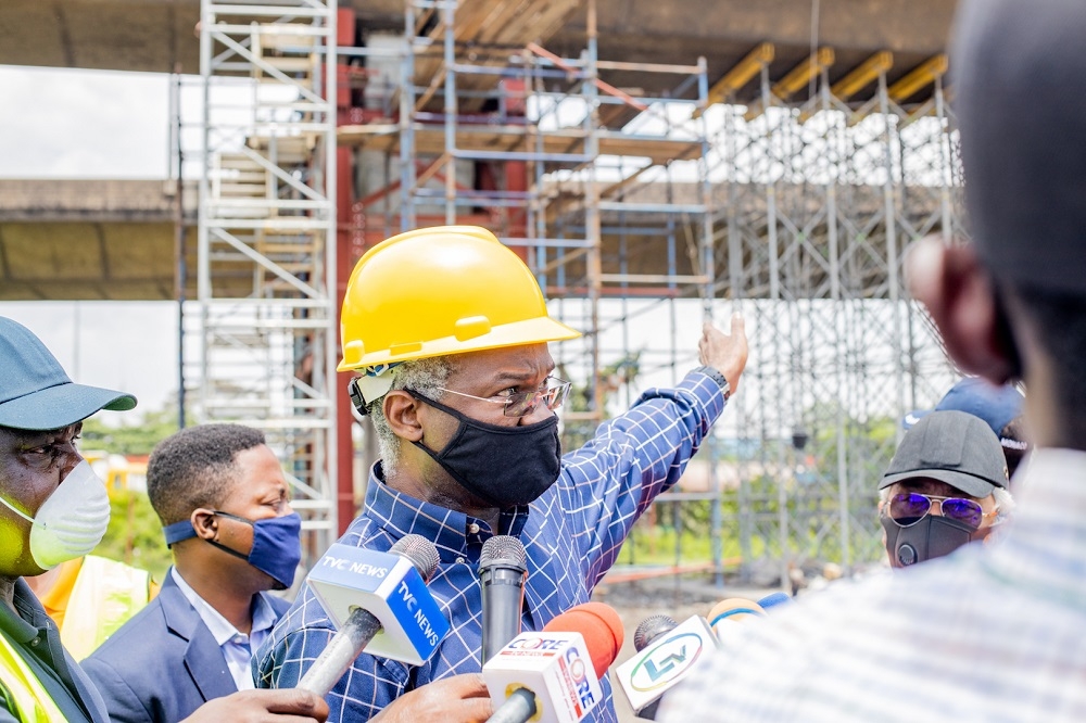 Hon. Minister of Works and Housing, Mr Babatunde Fashola,SAN (right) flanked by the Federal Controller of Works in Lagos, Engr.Olukayode Â Popoola(left) as he makes a point while speaking with Journalists shortly after Â anÂ inspection of the Â Ongoing Emergency Repairs of Eko Bridge (Phase I) in Lagos State on Thursday, 8th October 2020