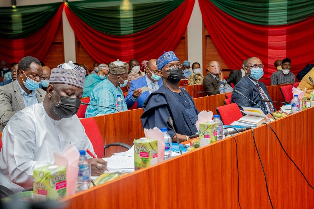 Hon. Minister of Works and Housing, Mr Babatunde Fashola,SAN (middle), Minister of State in the Ministry, Engr, Abubukar Aliyu (left) and Permanent Secretary, Mr Ernest Afolabi Umakhihe (right) during a Session of the Year 2021 Budget Defence hosted by the Senate Committee on Works at the New Senate Building, National Assembly Complex, Abuja on Wednesday , 21st Â October 2020