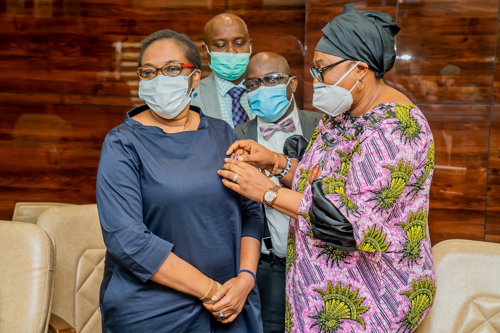 Special Adviser, Administration and Strategic Coordination to the Hon. Minister, Mrs Alimi Morayo shortly after being decorated with the Armed Forces Remembrance Day Celebration Emblem 2021 by Director Corporate Affairs, Mrs Grace Morenike Henry at the Ministry of Works and Housing Headquarters, Mabushi, Abuja on Tuesday, 17th November 2020