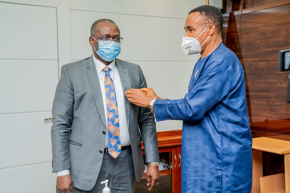 Permanent Secretary,Ministry of Works and Housing,  Mr Ernest Afolabi Umakhihe (left) shortly after being decorated with the Armed Forces Remembrance Day Celebration Emblem 2021 by the Secretary-General of the Nigerian Legion, Group Captain Kayode Abe(Rtd) at the Ministry of Works and Housing Headquarters, Mabushi, Abuja on Tuesday, 17th November 2020