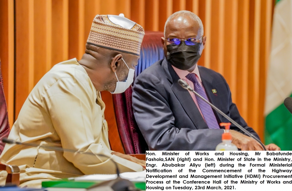 Hon. Minister of Works and Housing, Mr Babatunde Fashola,SAN (right) and Hon. Minister of State in the Ministry, Engr. Abubakar Aliyu (left) during the Formal Ministerial Notification of the Commencement of the Highway Development and Management Initiative (HDMI) Procurement Process at the Conference Hall of the Ministry of Works and Housing on Tuesday, 23rd March, 2021.