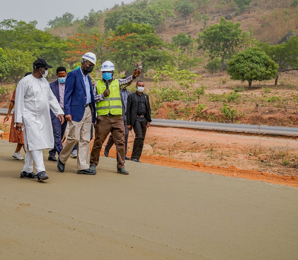 Hon. Minister of Works &amp; Housing, Mr Babatunde Fashola,SAN(middle), Minister of State in the Ministry, Engr. Abubakar Aliyu(left) and Project Manager, China Harbour Engineering Company Ltd (CHEC), Engr. Hussaini Shagbo(right)  during the inspection of the ongoing construction work on the expansion of 5.4km Abuja - Keffi Expressway and Dualization of Keffi - Akwanga - Lafia - Makurdi Road project in Nasarawa State on Tuesday, 30th March 2021