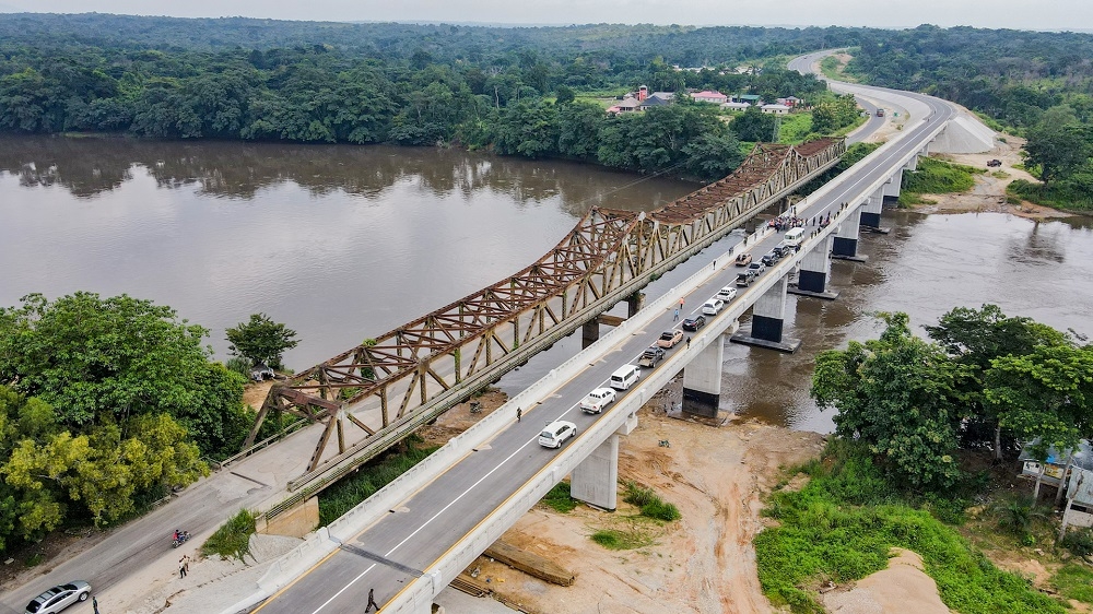 A view of the New  Ikom Bridge built by the administration of President Muhammadu Buhari during an inspection visit by the Hon. Minister of Works and Housing, Mr. Babatunde Fashola, SAN on Monday 26th July 2021.On the left is the old Steel truss-Bridge built 50 years ago in 1971.