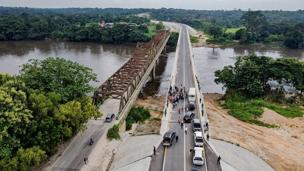 A view of the New  Ikom Bridge built by the administration of President Muhammadu Buhari during an inspection visit by the Hon. Minister of Works and Housing, Mr. Babatunde Fashola, SAN on Monday 26th July 2021.On the left is the old Steel truss-Bridge built 50 years ago in 1971.