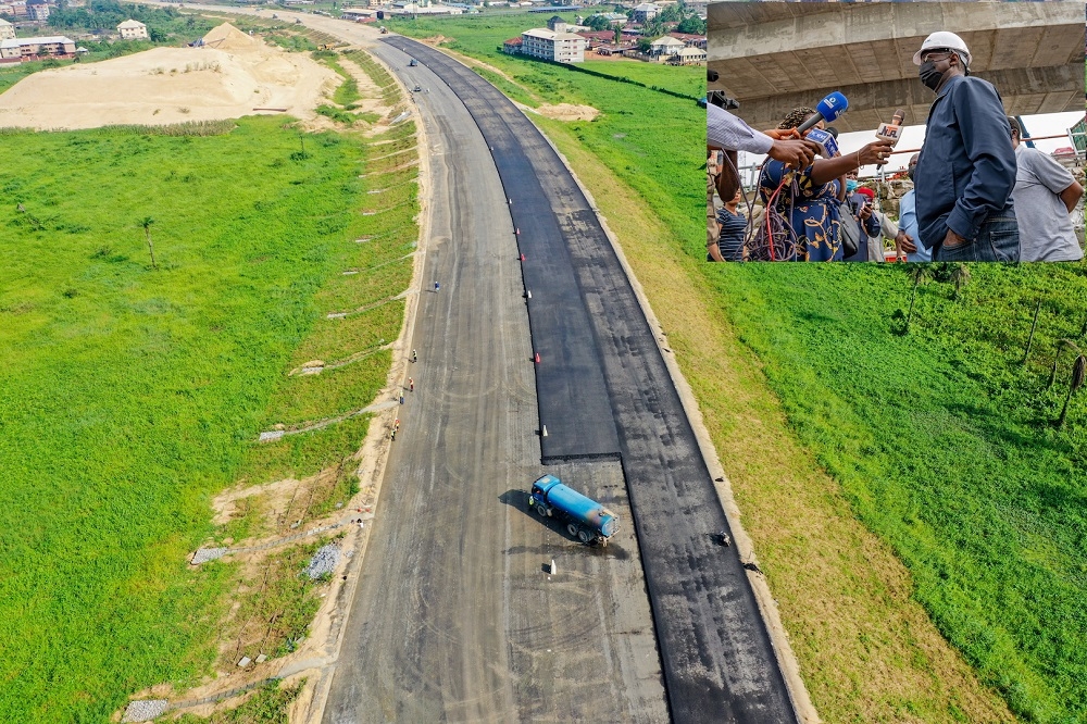 A view of the ongoing pavement works at the Anambra Section of the Access road to the 2nd Niger Bridge during an inspection visit by the Hon. Minister of Works and Housing, Mr. Babatunde Fashola, SAN on Tuesday, 10th August 2021. INSET: The Hon. Minister of Works and Housing, Mr. Babatunde Fashola, SAN (right),  speaking with journalists shortly after the inspection of the ongoing construction of Main Works and Associated Infrastructure of the 2nd Niger Bridge in Anambra and  Delta States on Tuesday, 10th August 2021