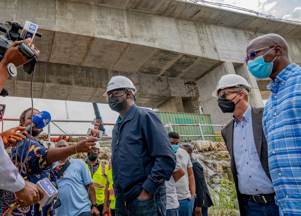 Hon. Minister of Works and Housing, Mr. Babatunde Fashola, SAN (left), joined by the Federal Controller of Works, Anambra State, Engr. Ajani Adeyemo (right) and the Project&#039;s Technical Director, Julius Berger Nigeria Plc, Engr. Stefan Uelzman (middle) while speaking with journalists shortly after the inspection of the ongoing construction of Main Works and Associated Infrastructure of the 2nd Niger Bridge in Delta and Anambra States on Tuesday, 10th August 2021