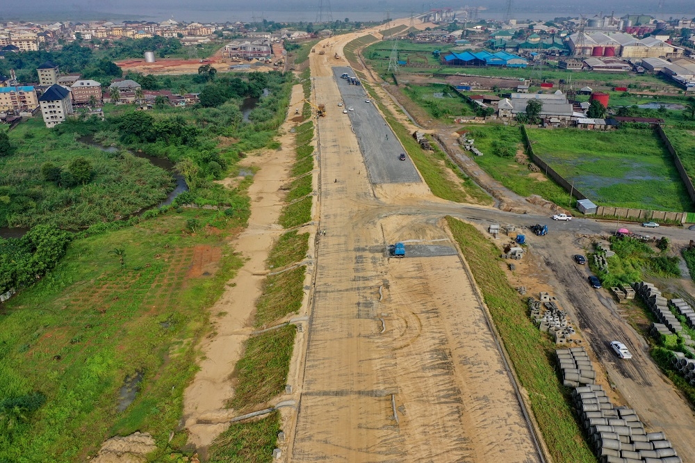 A view of the ongoing pavement works at the Anambra Section of the Access road to the 2nd Niger Bridge during an inspection of the ongoing construction of Main Works and Associated Infrastructure of the 2nd Niger Bridge in Delta and Anambra States by the Hon. Minister of Works and Housing, Mr. Babatunde Fashola, SAN on Tuesday, 10th August 2021