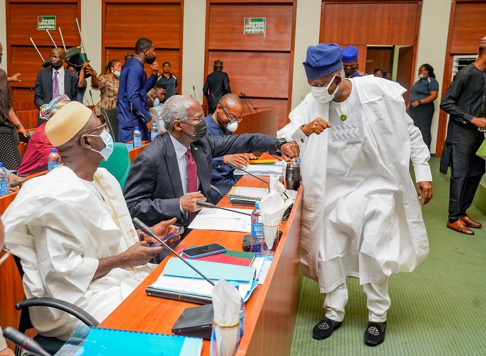 Hon. Minister of Works and Housing, Mr Babatunde Fashola, SAN (middle), Permanent Secretary in the Ministry of Works and Housing, Mr. Babangida Hussaini (left), and Deputy Chairman, House Committee on Works and member representing Abeokuta South Federal Constituency, Ogun State, Hon. Edun Olanrewaju Oladapo (right) during a Session of the Year 2022 Budget Defence hosted by the House of Representatives Committee on Works at the Conference Meeting Room 231, Ground Floor, National Assembly Complex, Abuja on Wednesday, 3rd November 2021