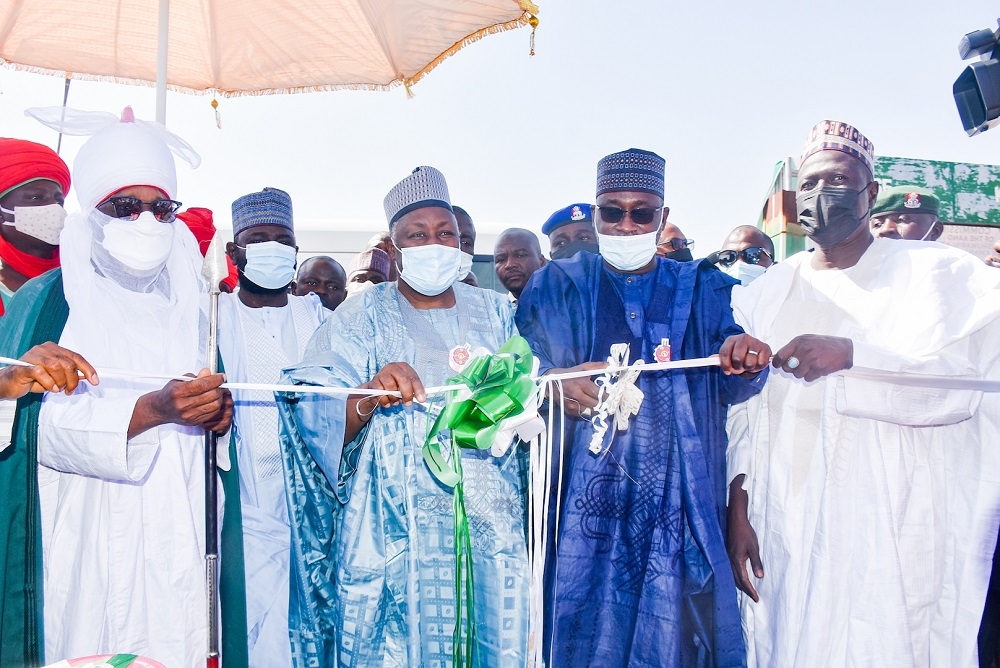 Representative of President Muhammadu Buhari and Hon. Minister of  Water Resources, Engr. Suleiman Adamu (2nd right), Governor of Jigawa State, Alhaji Muhammad Badaru Abubakar (middle), representative of the Hon. Minister of Works &amp; Housing and Permanent Secretary in the Ministry , Mr Babangida Hussaini (right), Emir of Dutse, Alhaji Nuhu Muhammadu Sanusi (left) and others  during the Federal Government&#039;s commissioning and Handover of Kano - Maiduguri Road,Section II (Shuwarin - Azare) with Spur from Dutse to Kwanar Huguma in Jigawa/Bauchi States at Shuwarin on Monday 13th December 2021.