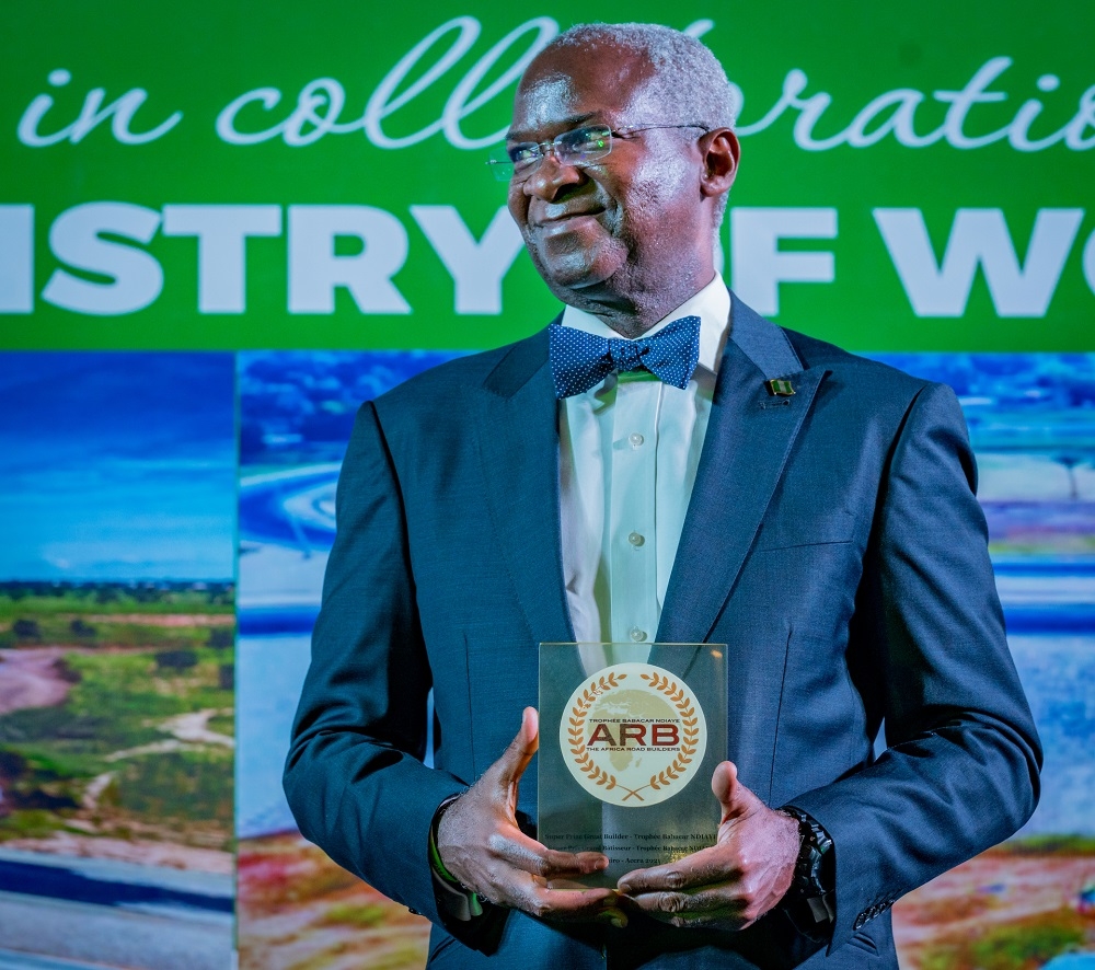 Representative of President Muhammadu Buhari and Hon. Minister of Works and Housing, Mr Babatunde Fashola,SAN  shortly after receiving  the Super Prize Global Trophy of the Africa Road Builders - Trophee Babacar Ndiaye on behalf of His Excellency, President Muhammadu Buhari at the Inaugural Conference Dinner for the 7th Edition of the Africa Road Builders - Trophee Babacar Ndiaye Conference with the theme,&#039; Building Roads, Building Economies&quot;at  the Transcorp Hilton Hotel , Abuja on Thursday 31st March 2022. 