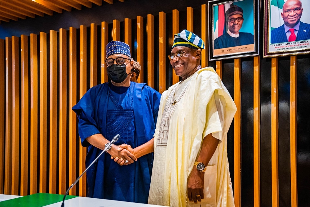 Minister of State for Works and Housing, Hon. Umar El-Yakub (left) and Chairman of Council of the Registered Builders of Nigeria (CORBON), Bldr. (Dr) Samson Ameh Opaluwah (right), in a group photograph shortly after the inauguration of Members of the Council of the Registered Builders of Nigeria (CORBON) at the Ministry of Works and Housing, Headquarters, Mabushi, Abuja on Tuesday, 9th August 2022. 